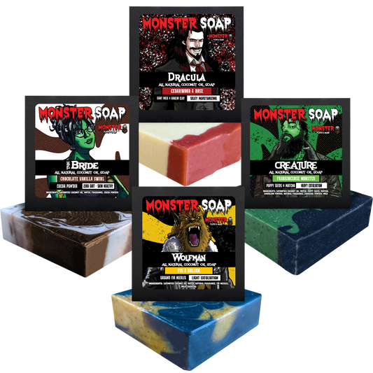 Universal Appeal Soap Bundle - Dracula, Bigfoot, The Creature, and the Bride MONSTER Soap Bars. Pictured: All four bars of soap. Dracula is a goat milk soap with white color and red on top due to rose kaolin clay. Bride is white and brown swirled with cocoa powder. The wolfman is yellow and black with charcoal powder. Creature is green and black with charcoal powder and mica.
